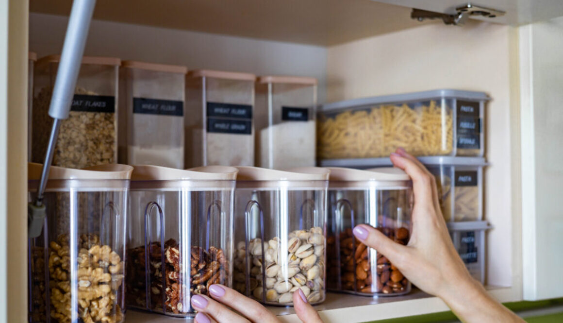 Domestic healthy vegetarian dry food storage organization on shelf at kitchen cupboard skladovanie potravín