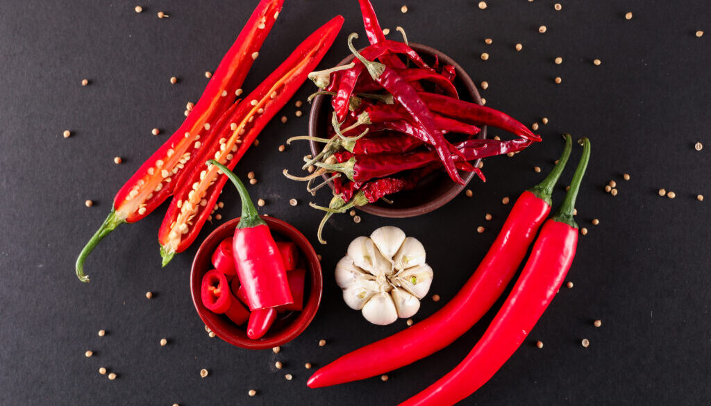 red chili pepper sliced with garlic pepper in ceramic bowl dried red chili pepper top view