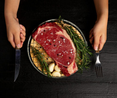 fresh raw beef steak on the dark background.